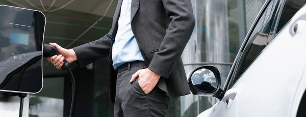 Closeup Progressive Black Suit Businessman Insert Charger Plug Public Charging — Stok fotoğraf
