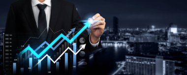 Businessman analyst working with digital finance business data graph showing technology of investment strategy for perceptive financial business decision. Digital economic analysis technology concept.