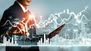 Businessman analyst working with digital finance business data graph showing technology of investment strategy for perceptive financial business decision. Digital economic analysis technology concept.