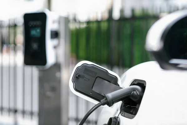 Focus Closeup Electric Vehicle Plugged Charger Device Blurred Background Public — Fotografia de Stock