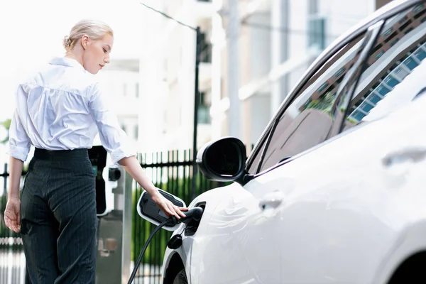 Progressive Businesswoman Insert Charger Plug Charging Station Her Electric Vehicle — Foto Stock