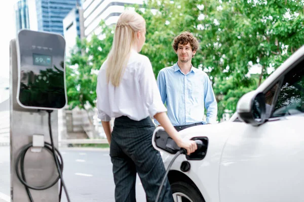 Progressive Businessman Businesswoman Electric Car Parking Connected Public Charging Station — ストック写真