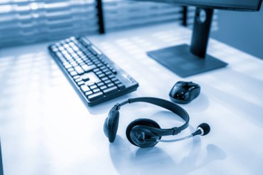Essential equipment concept for competent online operators, call service agents, or online working. Customer service equipment, as well as helpdesk tools.