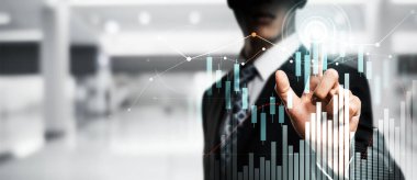 Businessman analyst working with digital finance business data graph showing technology of investment strategy for perceptive financial business decision. Digital economic analysis technology concept.