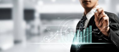 Businessman analyst working with digital finance business data graph showing technology of investment strategy for perceptive financial business decision. Digital economic analysis technology concept.
