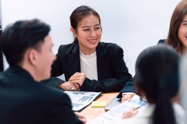 Business team of financial data analysis meeting with business intelligence, report paper and dashboard on laptop for marketing strategy. Business people working together to promote harmony in office.