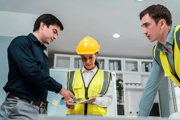 Team Competent Engineers Wearing Safety Equipment Working Blueprints Tablet While — Stockfoto
