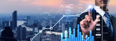 Businessman analyst working with digital finance business data graph showing technology of investment strategy for perceptive financial business decision. Digital economic analysis technology concept.