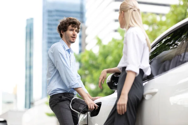 Progressive Businessman Businesswoman Electric Car Connected Charging Station Driving City — Foto Stock