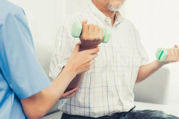Contented Senior Patient Doing Physical Therapy Help His Caregiver Senior — Foto Stock