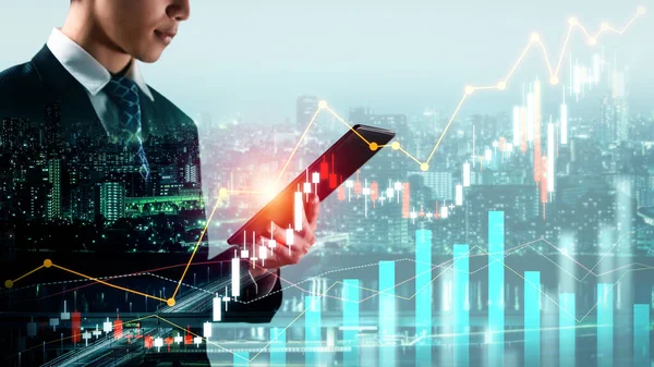 Businessman analyst working with digital finance business data graph showing technology of investment strategy for perceptive financial business decision. Digital economic analysis technology concept.