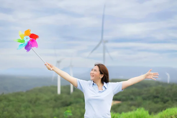 Concept Progressive Happy Woman Relaxing Wind Turbine Farm Windmill Toy — Fotografia de Stock