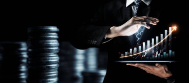 Businessman analyst working with digital finance business data graph showing technology of investment strategy for perceptive financial business decision. Digital economic analysis technology concept.
