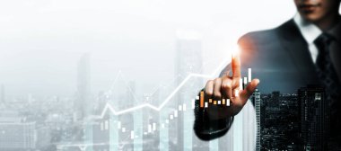 Businessman analyst working with digital finance business data graph showing technology of investment strategy for perceptive financial business decision. Digital economic analysis technology concept.