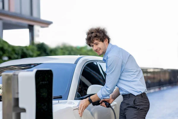 Progressive Businessman Insert Charger Plug Charging Station His Electric Vehicle — Stockfoto