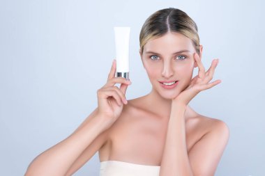 Alluring beautiful perfect cosmetic skin woman portrait hold mockup tube cream or moisturizer for skincare treatment, anti-aging product in isolated background. Natural healthy skin model concept.