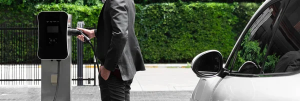 Closeup Progressive Black Suit Businessman Insert Charger Plug Public Charging — 图库照片