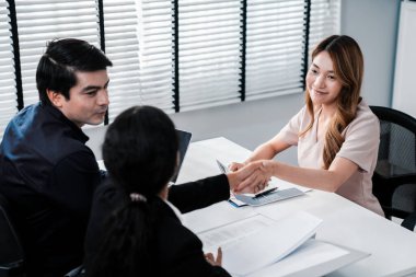 A new and competent female employee successfully interviewed. Newly graduated gets her first job after the interview.