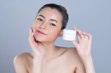 Glamorous beautiful perfect cosmetic skin with soft makeup woman portrait hold mockup jar cream or moisturizer for skincare treatment and anti-aging product advertisement in isolated background.