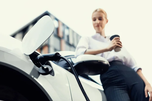 Progressive Businesswoman Electric Car Charging Station Driving City Center Eco — Stock fotografie