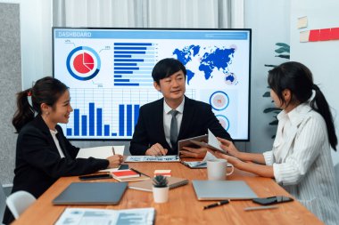 Business team of financial data analysis meeting with business intelligence, report paper and dashboard on laptop for marketing strategy. Business people working together to promote harmony in office.