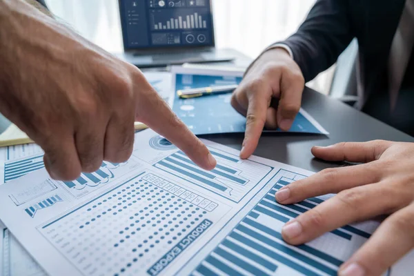 stock image Closeup busy analyst team discussing financial data on digital dashboard, analyzing chart and graph using data science software display on a laptop screen. Business intelligence and Fintech. Fervent