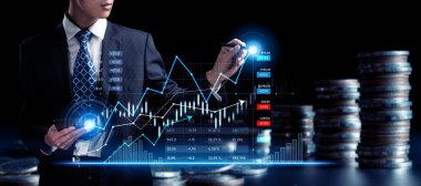 Businessman analyst working with digital finance business data graph showing technology of investment strategy for perceptive financial business decision. Digital economic analysis technology concept.