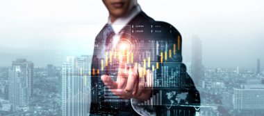 Businessman analyst working with digital finance business data graph showing technology of investment strategy for perceptive financial business decision. Digital economic analysis technology concept.