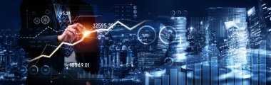 Businessman analyst working with digital finance business data graph showing technology of investment strategy for perceptive financial business decision. Digital economic analysis technology concept.