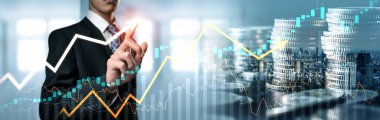 Businessman analyst working with digital finance business data graph showing technology of investment strategy for perceptive financial business decision. Digital economic analysis technology concept.