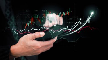 Businessman analyst working with digital finance business data graph showing technology of investment strategy for perceptive financial business decision. Digital economic analysis technology concept.