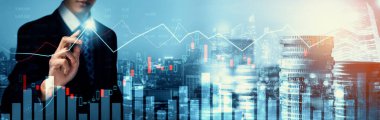 Businessman analyst working with digital finance business data graph showing technology of investment strategy for perceptive financial business decision. Digital economic analysis technology concept.