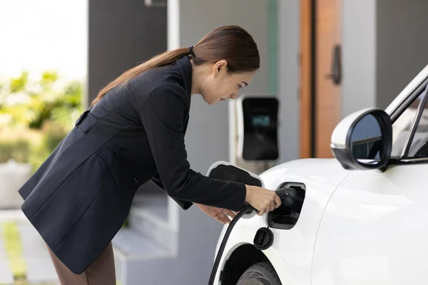 Progressive Woman Install Cable Plug Her Electric Car Home Charging — Foto de Stock