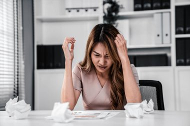 A competent female employee who has become completely exhausted as a result of overburdened work. Concept of unhealthy life as an office worker, office syndrome.