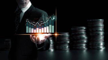 Businessman analyst working with digital finance business data graph showing technology of investment strategy for perceptive financial business decision. Digital economic analysis technology concept.