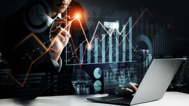 Businessman analyst working with digital finance business data graph showing technology of investment strategy for perceptive financial business decision. Digital economic analysis technology concept.