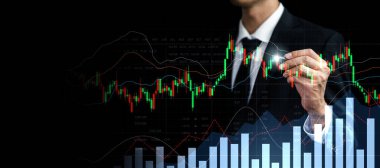Businessman analyst working with digital finance business data graph showing technology of investment strategy for perceptive financial business decision. Digital economic analysis technology concept.