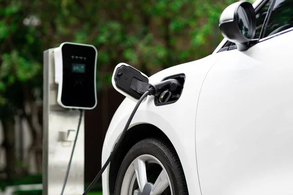 Focus Closeup Electric Vehicle Plugged Charger Device Blurred Background Public — Foto de Stock