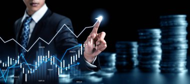 Businessman analyst working with digital finance business data graph showing technology of investment strategy for perceptive financial business decision. Digital economic analysis technology concept.