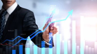 Businessman analyst working with digital finance business data graph showing technology of investment strategy for perceptive financial business decision. Digital economic analysis technology concept.