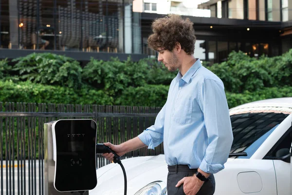 Progressive Businessman Insert Charger Plug Charging Station His Electric Vehicle — Foto de Stock