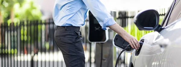 Closeup Progressive Man Holding Charger Plug Public Charging Station Electric — Foto de Stock