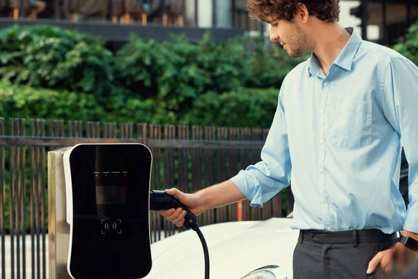 Progressive Businessman Insert Charger Plug Charging Station His Electric Vehicle — Foto Stock