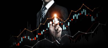 Businessman analyst working with digital finance business data graph showing technology of investment strategy for perceptive financial business decision. Digital economic analysis technology concept.