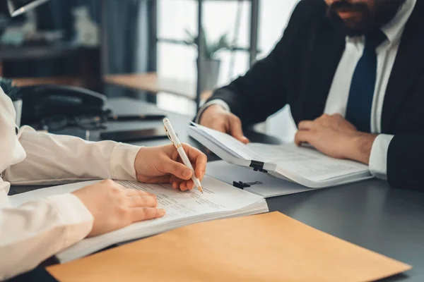 stock image Businesspeople working in the office on official corporate papers, office workers reviewing stack of financial documents and working on business report. Equilibrium