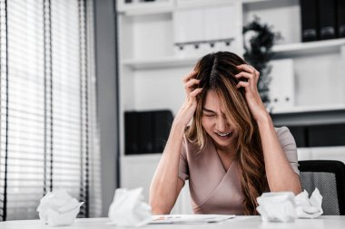 A competent female employee who has become completely exhausted as a result of overburdened work. Concept of unhealthy life as an office worker, office syndrome.