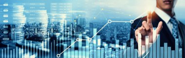 Businessman analyst working with digital finance business data graph showing technology of investment strategy for perceptive financial business decision. Digital economic analysis technology concept.