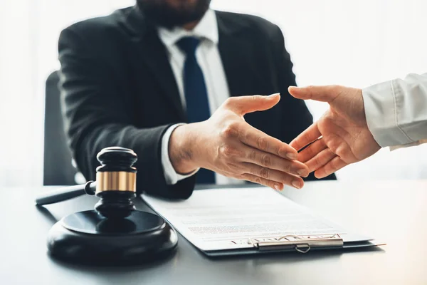 stock image Closeup lawyer or attorneys colleagues handshake after successful legal discussing on contract agreement for lawsuit to advocate resolves dispute in court ensuring trustworthy partner. Equilibrium