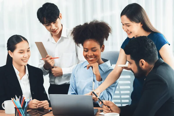 stock image Happy diverse business people work together, discussing in corporate office. Professional and diversity teamwork discuss business plan on desk with laptop. Modern multicultural office worker. Concord