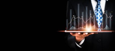 Businessman analyst working with digital finance business data graph showing technology of investment strategy for perceptive financial business decision. Digital economic analysis technology concept.